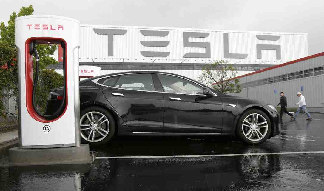 Why do Tesla owners tap the charger?